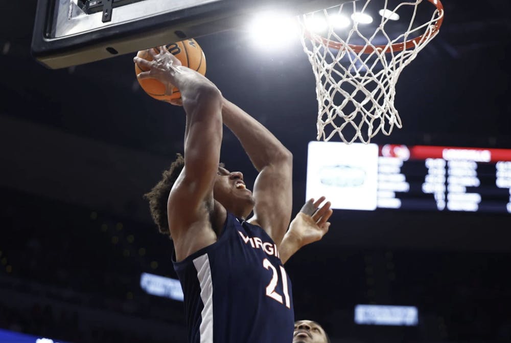 <p>Anthony Robinson practically snarls as he reaches for a dunk.</p>