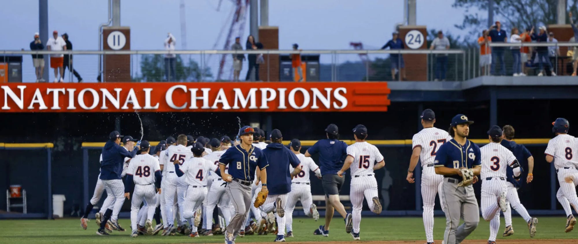 The Cavaliers celebrate a walk-off hit from graduate student outfielder Bobby Whalen.