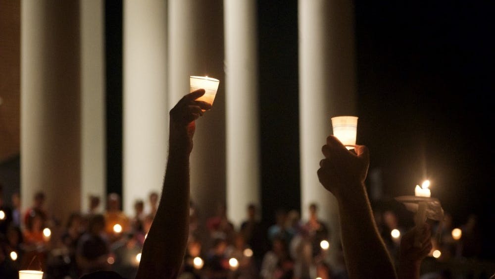 The University community came together for a candlelight vigil to oppose white supremacy and honor the memory of Heather Heyer.&nbsp;
