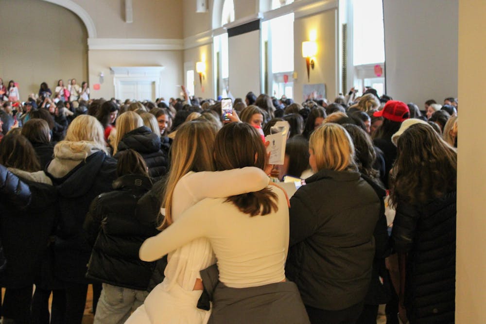 <p>Cheers filled the Newcomb Hall Ballroom Sunday as hundreds of students tore open envelopes to reveal which sororities they would get to call their new homes.</p>