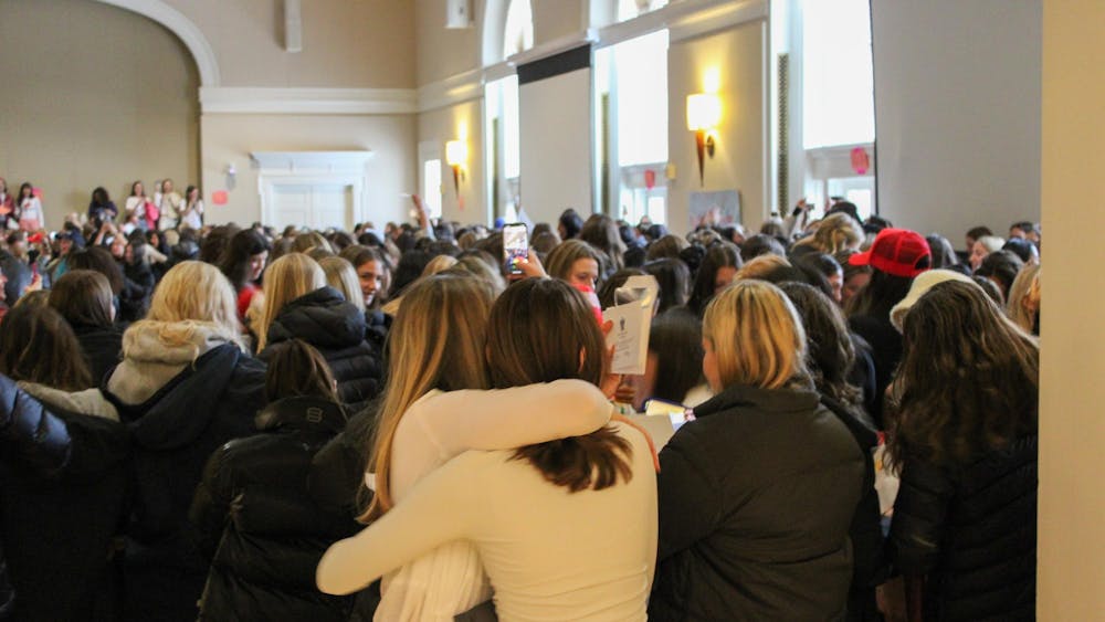 Cheers filled the Newcomb Hall Ballroom Sunday as hundreds of students tore open envelopes to reveal which sororities they would get to call their new homes.