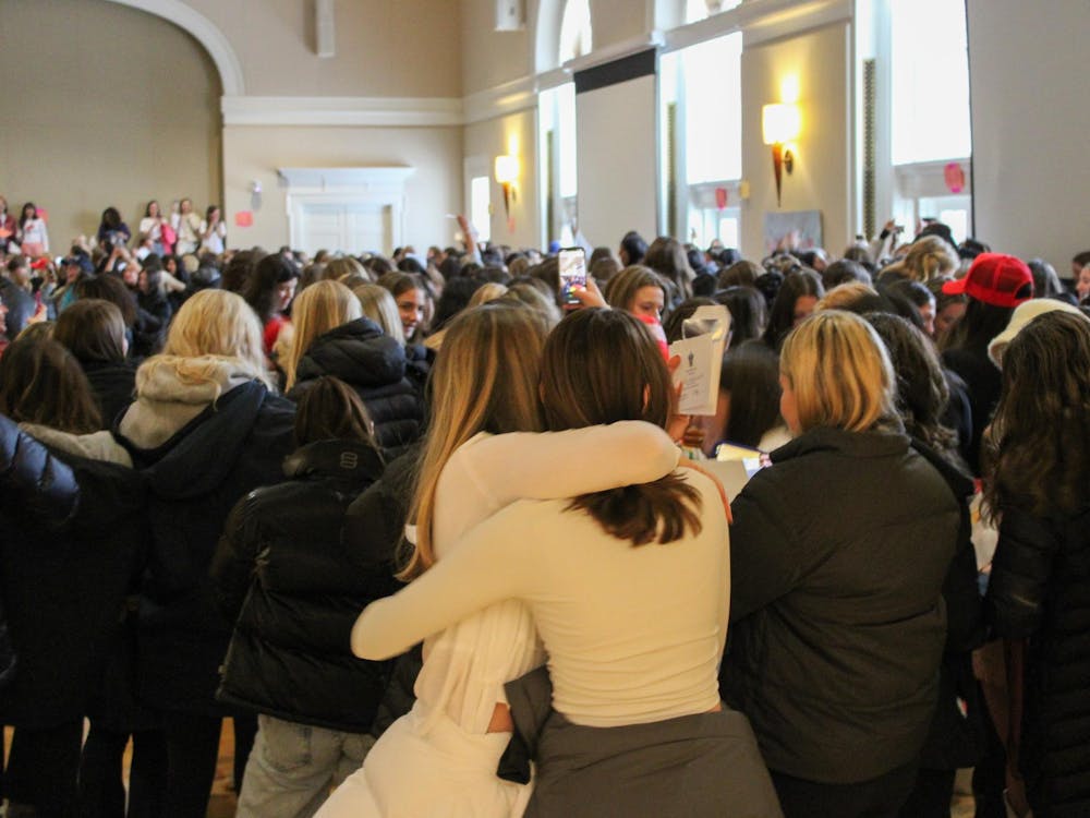 Cheers filled the Newcomb Hall Ballroom Sunday as hundreds of students tore open envelopes to reveal which sororities they would get to call their new homes.
