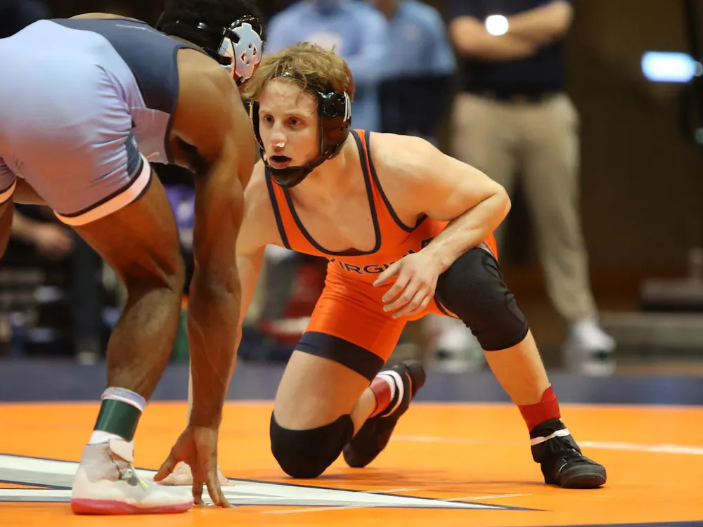 No. 23 graduate student Brian Courtney prepares to face off against his opponent on Friday.