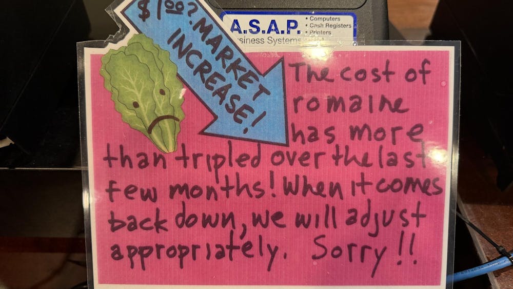 A sign at Bodo's Bagels, informing customers of a $1.00 surcharge for romaine lettuce, seen Nov. 11, 2025.