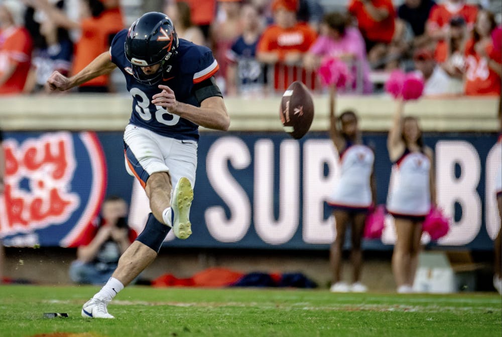 Graduate punter Daniel Sparks boots the football into enemy territory.