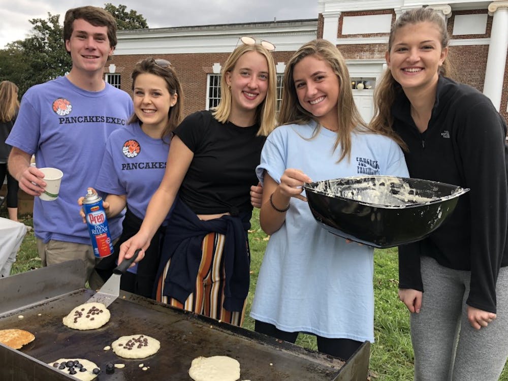 Volunteers at Pancakes for Parkinson's pose for a picture on the South Lawn Saturday while making pancakes.&nbsp;
