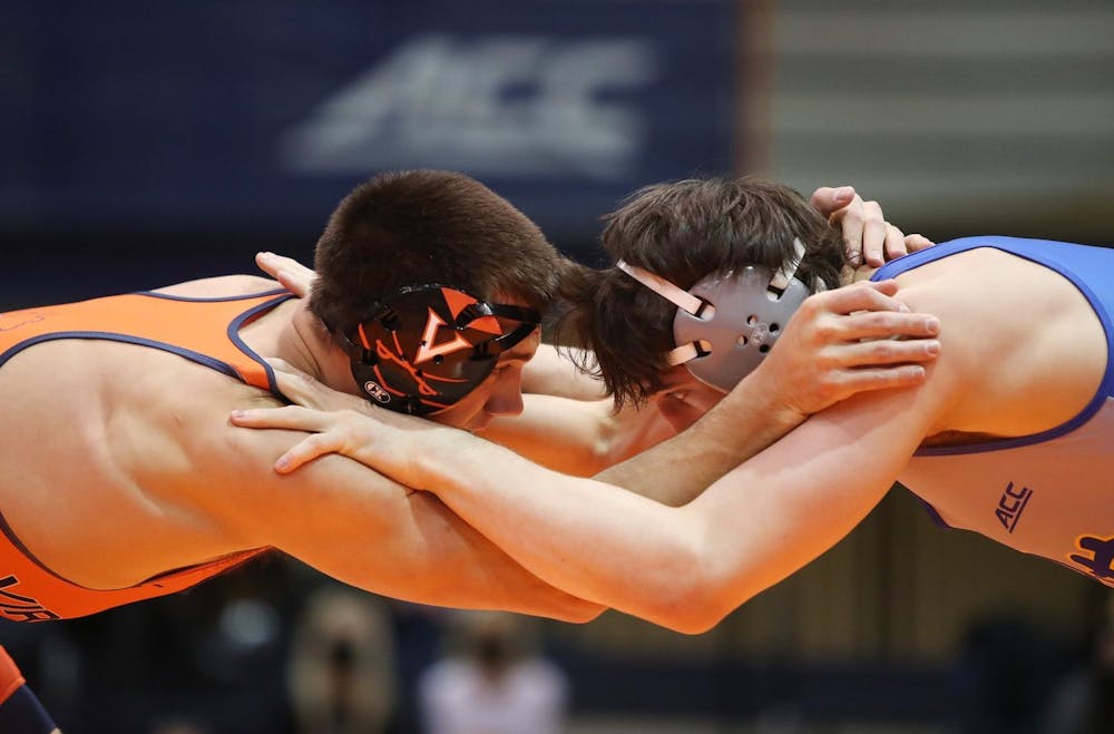 <p>Graduate student Jay Aiello grapples with an opponent in Virginia's 25-10 loss to No. 18 Pittsburgh last Friday.</p>