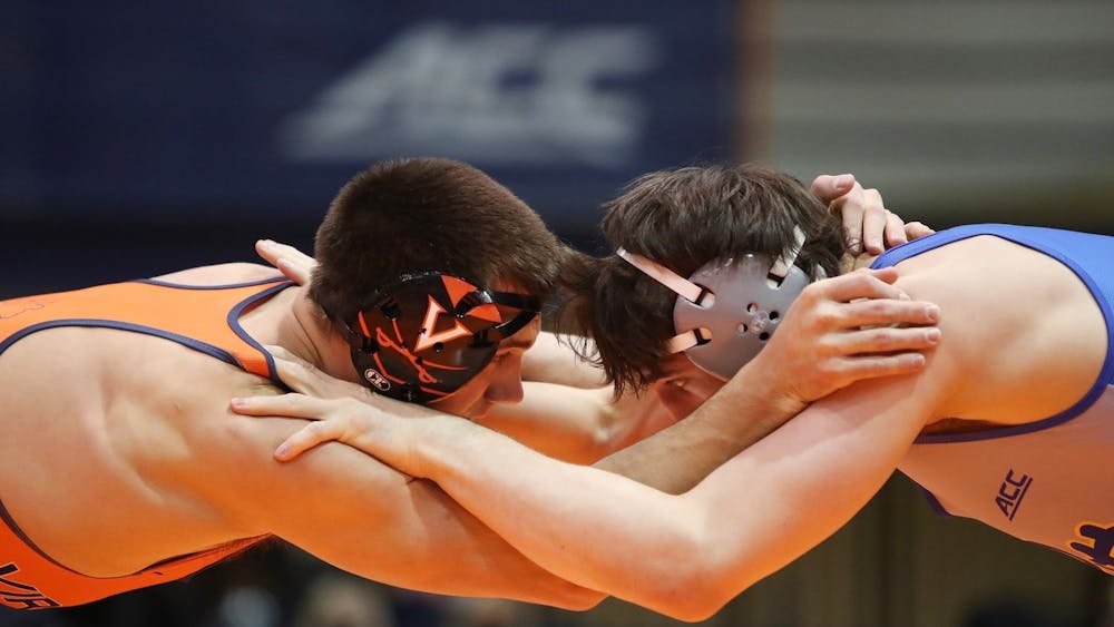Graduate student Jay Aiello grapples with an opponent in Virginia's 25-10 loss to No. 18 Pittsburgh last Friday.