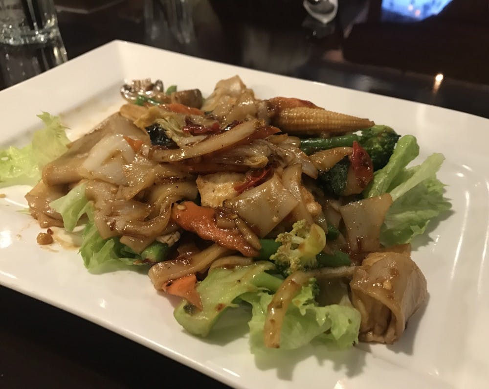 My plate arrived with a large pile of drunken noodles mixed with fresh vegetables. &nbsp;