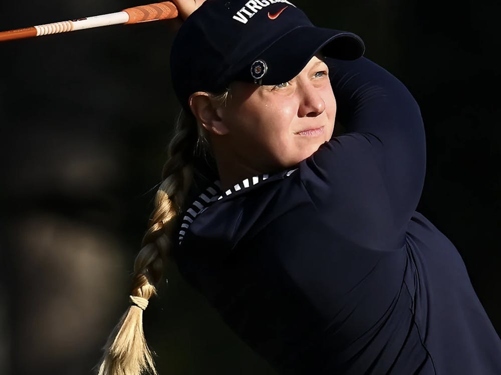 Smyth strikes a drive during her time as a Cavalier.