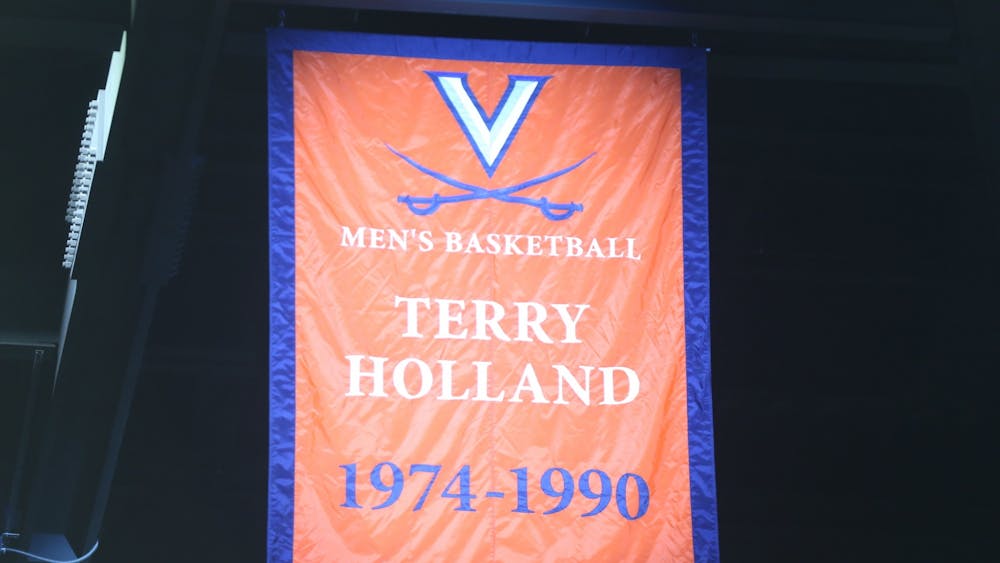 Athletic Director Carla Williams unveiled a banner commemorating Holland's achievements and impact on Virginia basketball Saturday.