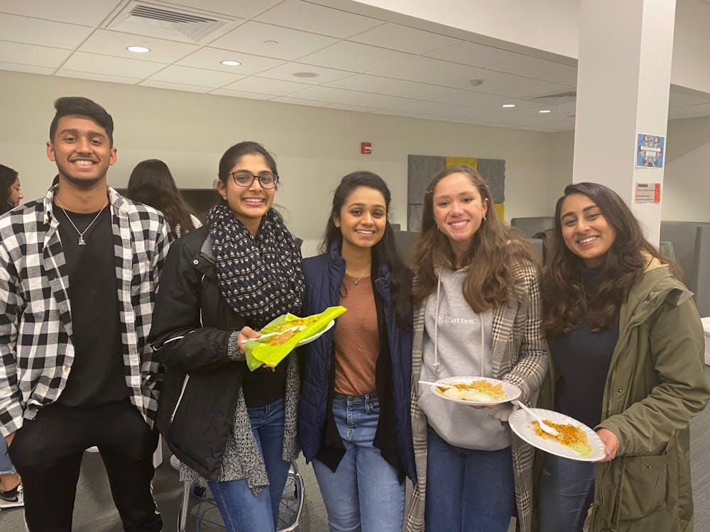 Students enjoy their traditional homemade South Indian cuisine in honor of Pongal.