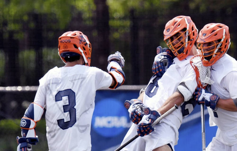 <p>Virginia players celebrate after a goal.</p>