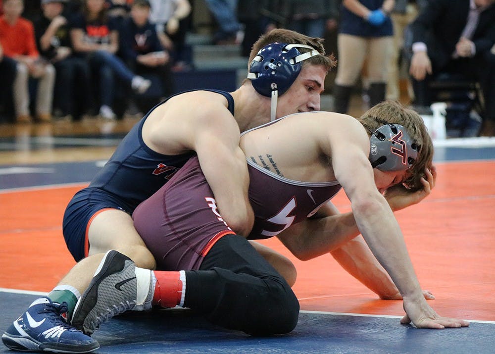 <p>Virginia junior George DiCamillo&nbsp;defeated Hokie junior Dennis Gustafson with a major decision, 14-4. DiCamillo's victory was one of just two all afternoon for the Cavaliers.</p>