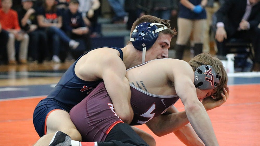 Virginia junior George DiCamillo&nbsp;defeated Hokie junior Dennis Gustafson with a major decision, 14-4. DiCamillo's victory was one of just two all afternoon for the Cavaliers.