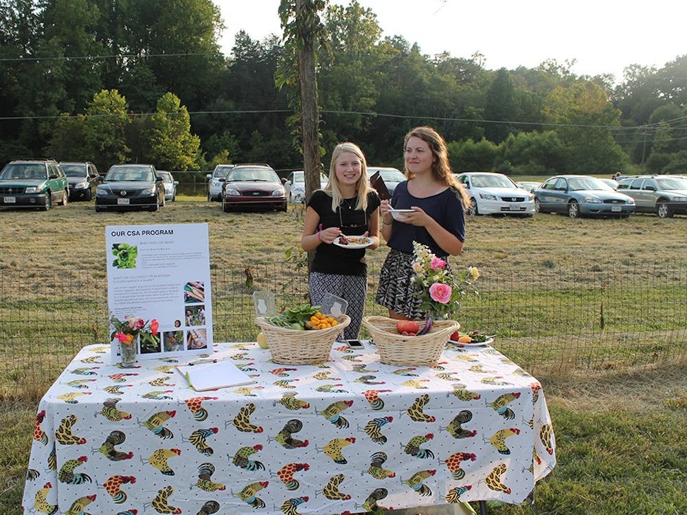 Morven Kitchen Garden volunteers promote their CSA program. 