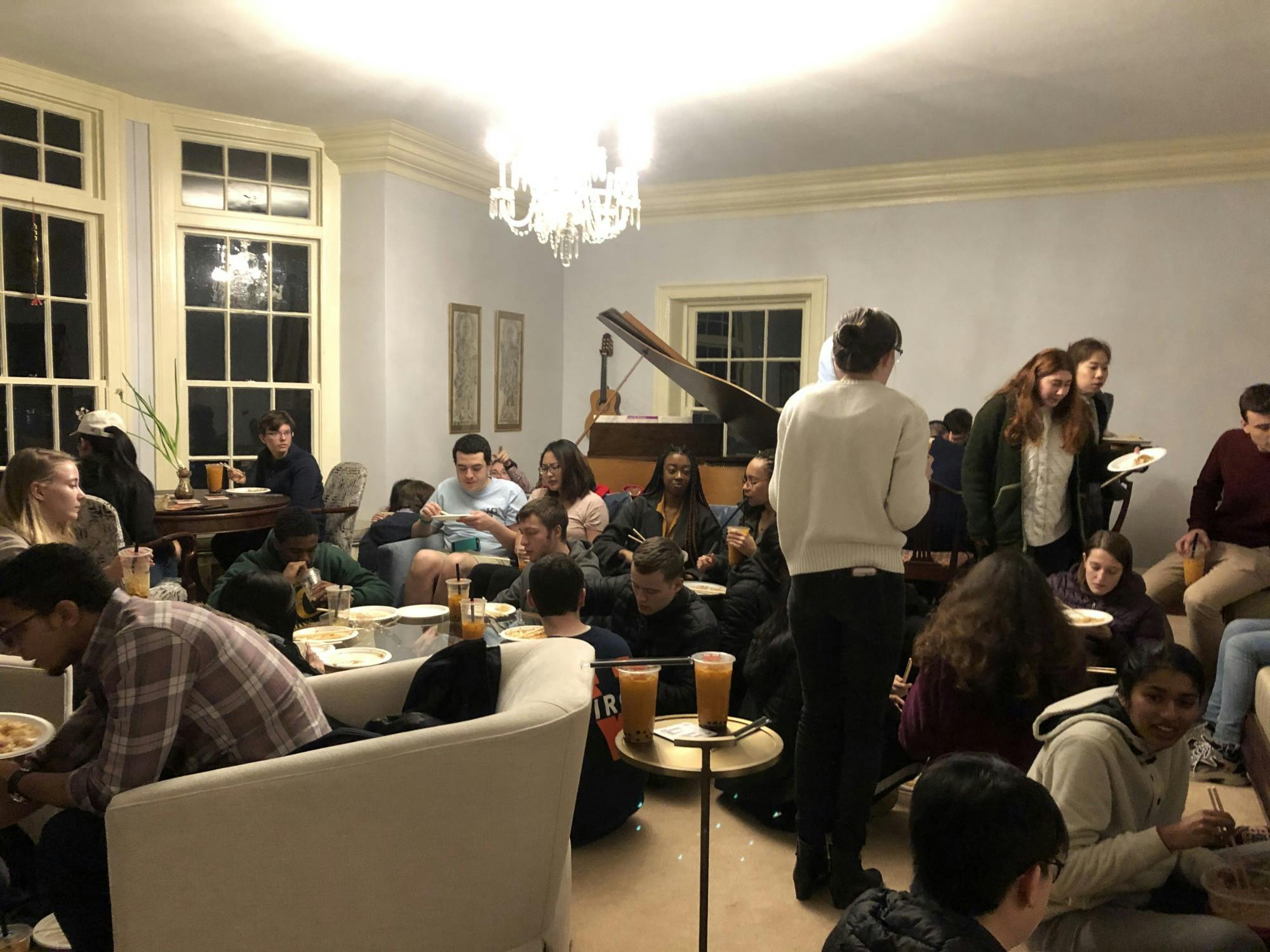 IRC residents gather in the living room of Big Morea for an evening of food and celebration.