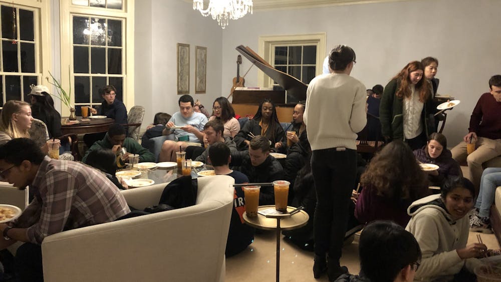 IRC residents gather in the living room of Big Morea for an evening of food and celebration.