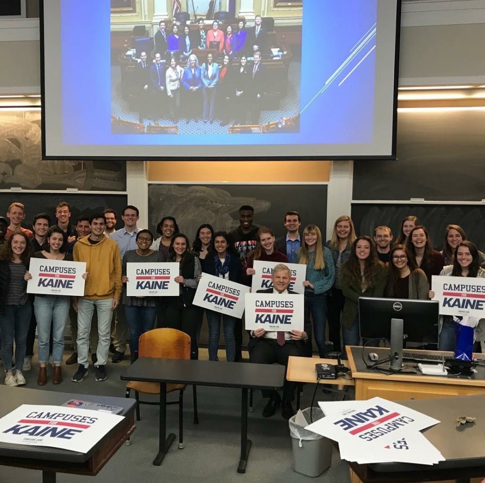 Toscano poses with members of the University Democrats at their meeting Wednesday.