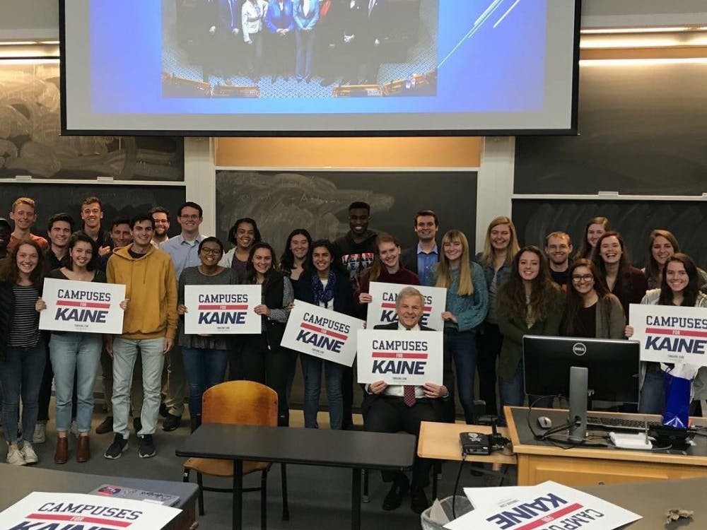 Toscano poses with members of the University Democrats at their meeting Wednesday.