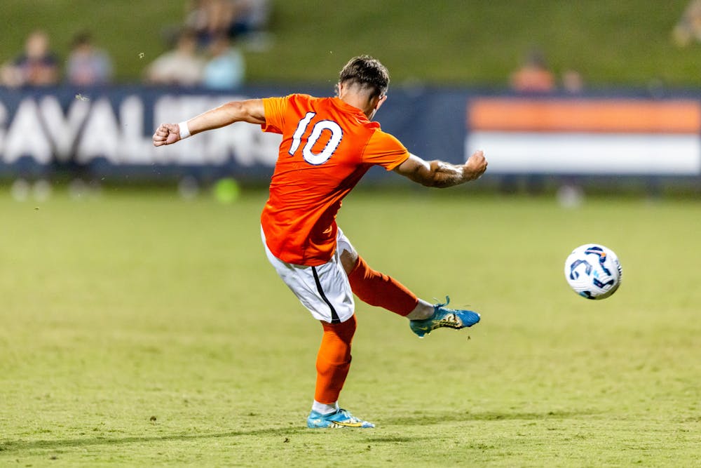 <p>Daniel Mangarov strikes a cross in the Colgate game.</p>