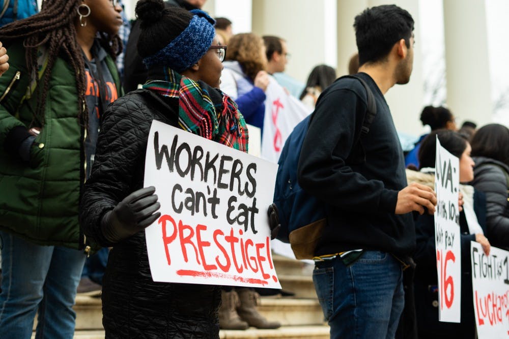 Dozens of demonstrators with the Living Wage Campaign were present at the rally outside the Rotunda March 1.