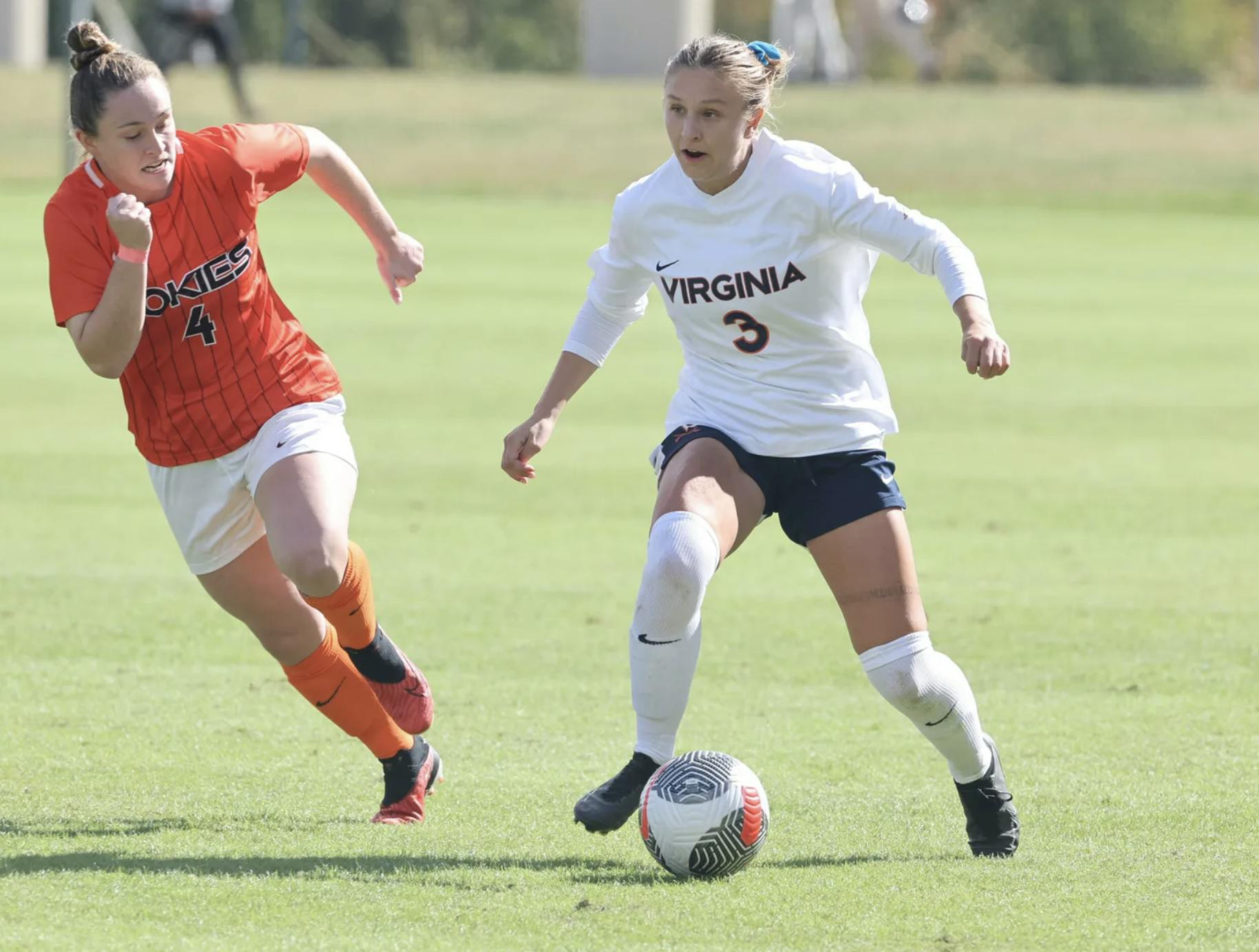 Senior midfielder Alexis Theoret works her way past a Hokie defender.