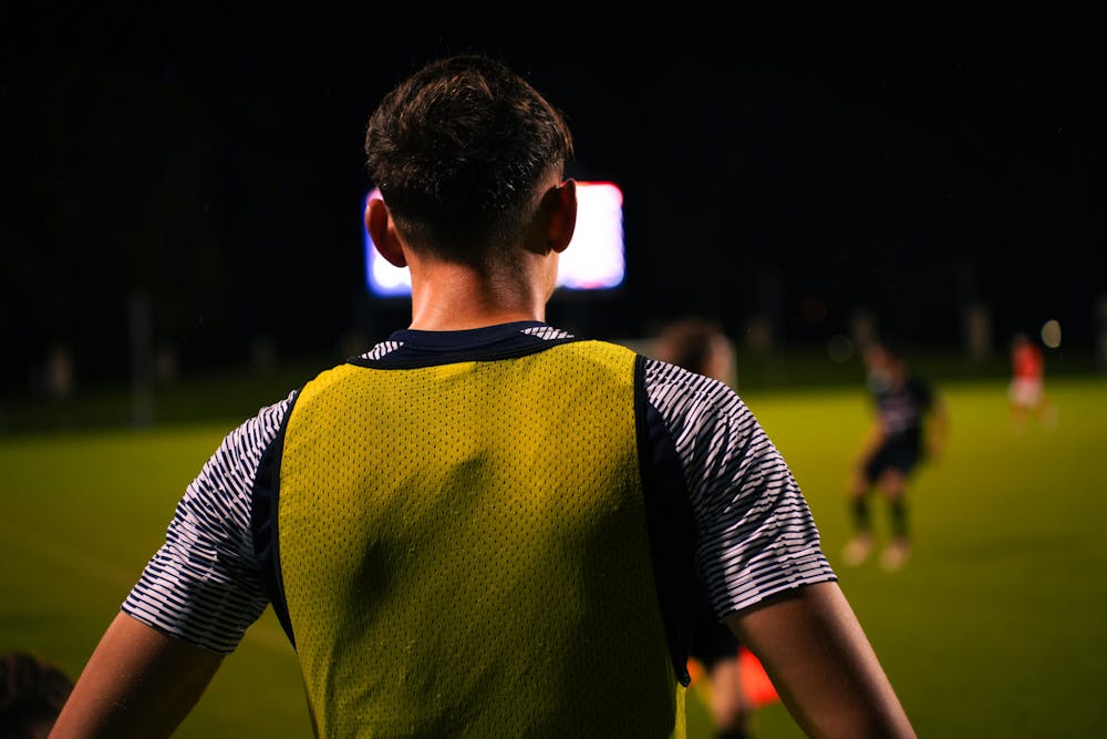 <p>Joaquín Brizuela looks on from the sideline during Virginia's game against Stanford.</p>