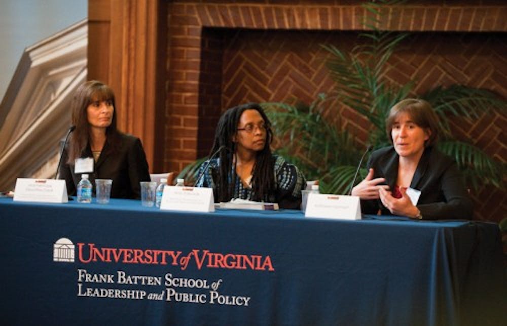 <p>Edwards (center) speaking on a panel at the Frank Batten School of Leadership and Public Policy in April 2013.&nbsp;</p>