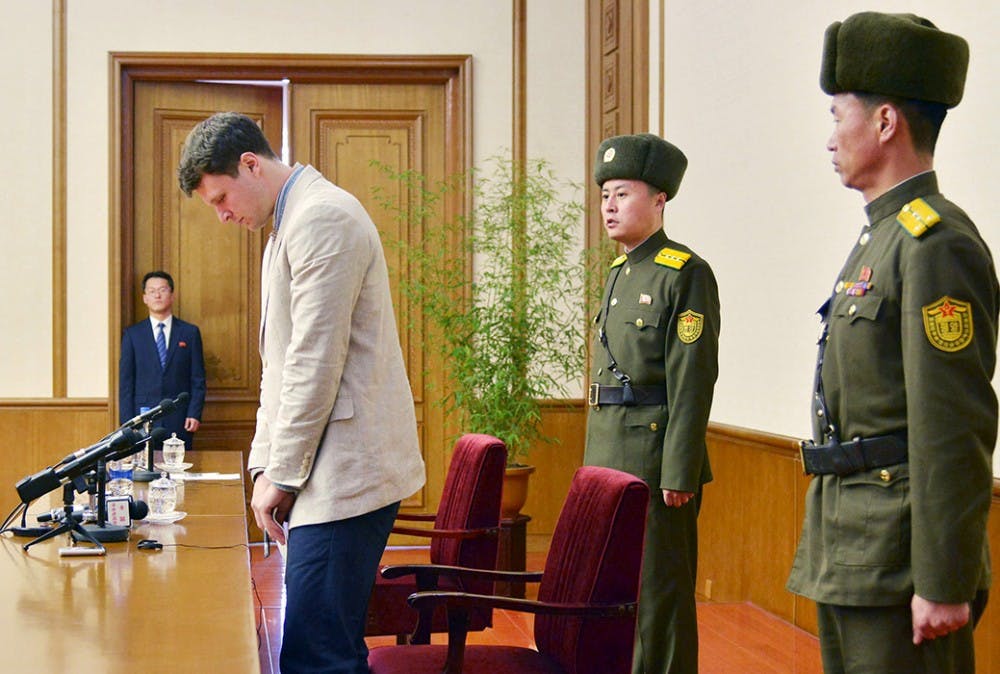 Otto Frederick Warmbier (3rd R), a University of Virginia student who has been detained in North Korea since early January, attends a news conference in Pyongyang, North Korea, in this photo released by Kyodo February 29, 2016. Warmbier was detained for trying to steal a propaganda slogan from his Pyongyang hotel and has confessed to "severe crimes" against the state, the North's official media said on Monday. Warmbier, 21, was detained before boarding his flight to China over an unspecified incident at his hotel, his tour agency told Reuters in January. Mandatory credit REUTERS/Kyodo ATTENTION EDITORS - FOR EDITORIAL USE ONLY. NOT FOR SALE FOR MARKETING OR ADVERTISING CAMPAIGNS. THIS IMAGE HAS BEEN SUPPLIED BY A THIRD PARTY. IT IS DISTRIBUTED, EXACTLY AS RECEIVED BY REUTERS, AS A SERVICE TO CLIENTS. MANDATORY CREDIT. JAPAN OUT. NO COMMERCIAL OR EDITORIAL SALES IN JAPAN. - RTS8H5V