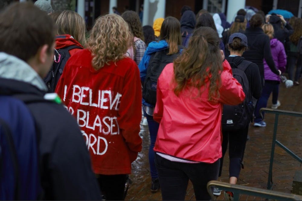 An attendee at the march wears a jacket reading "I believe Dr. Blasley Ford."&nbsp;