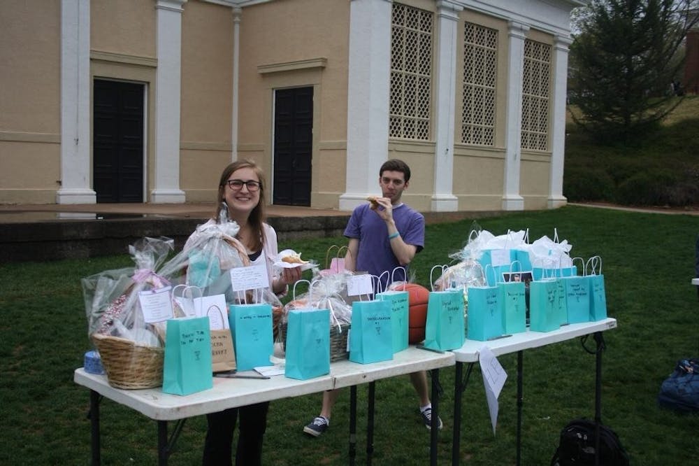<p>Kennedy Couch (left), a fourth-year College student and member of the Day of Healing committee, staffed the raffle table and helped pass out raffle tickets to students.&nbsp;</p>