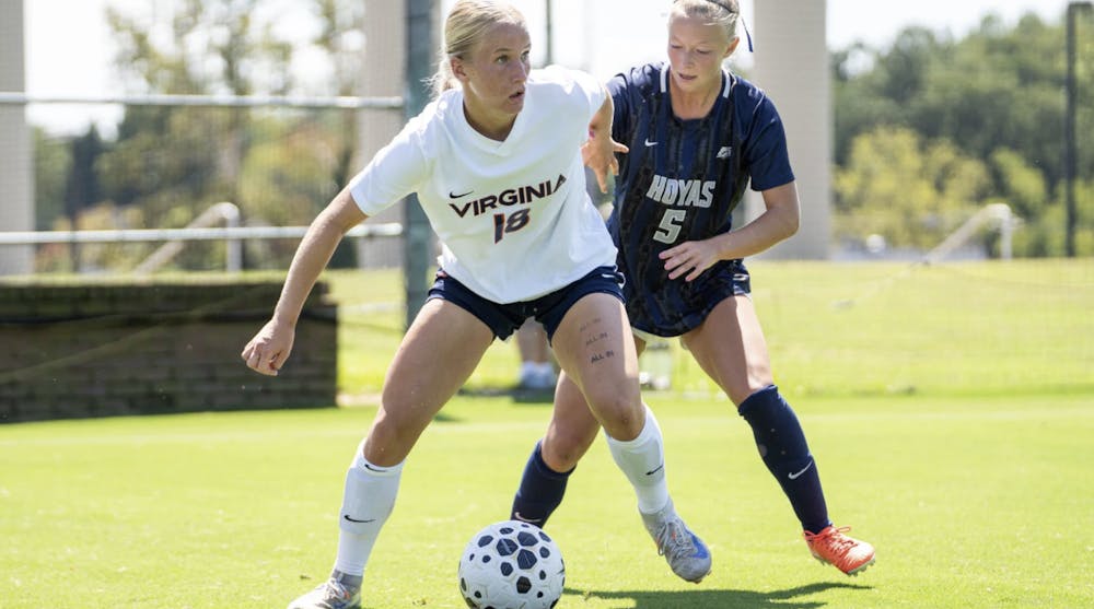 <p>Liv Rademaker repels a Georgetown defender.</p>