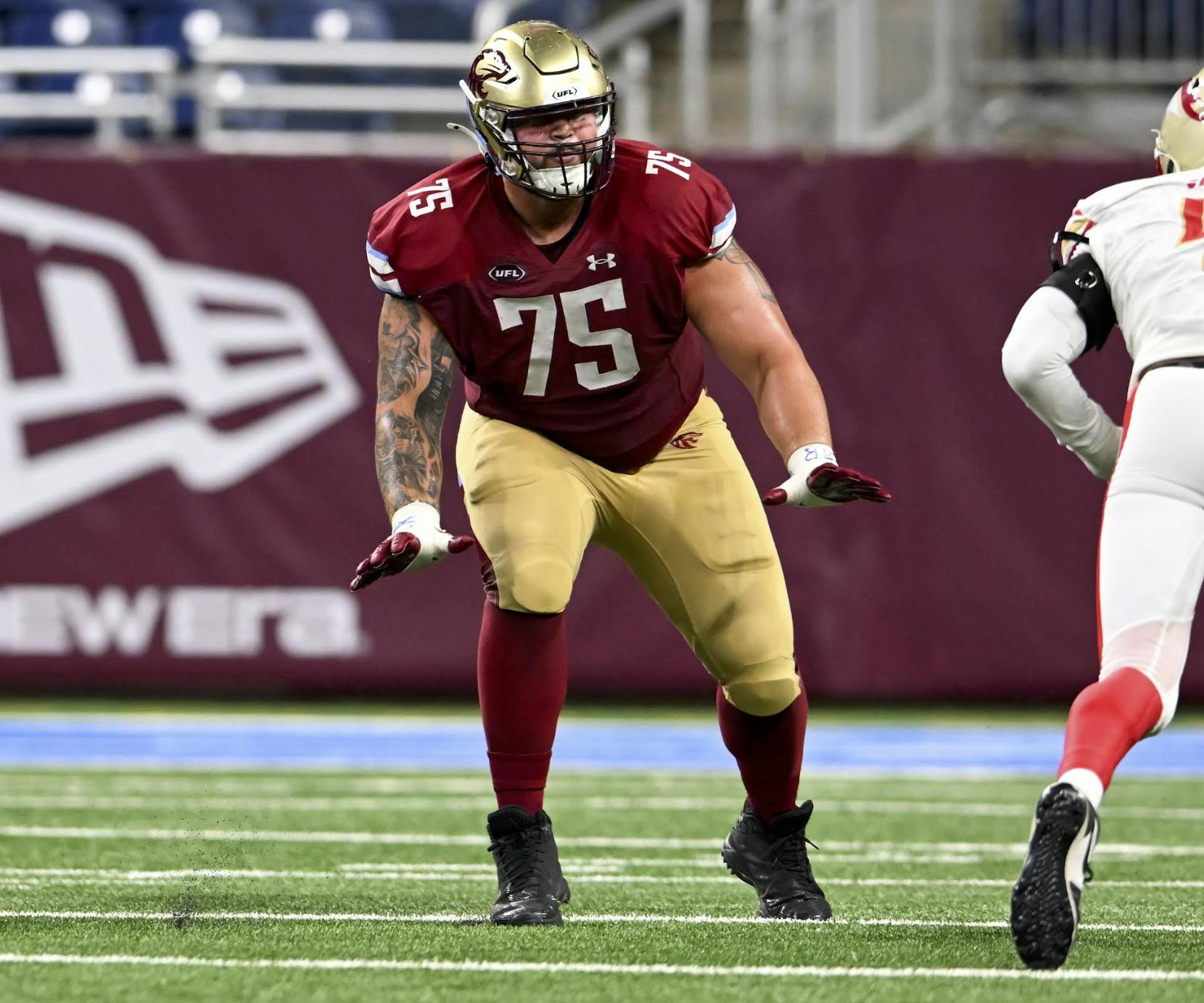 Nelson blocks for Bryce Perkins, another former Cavalier, with the Michigan Panthers.