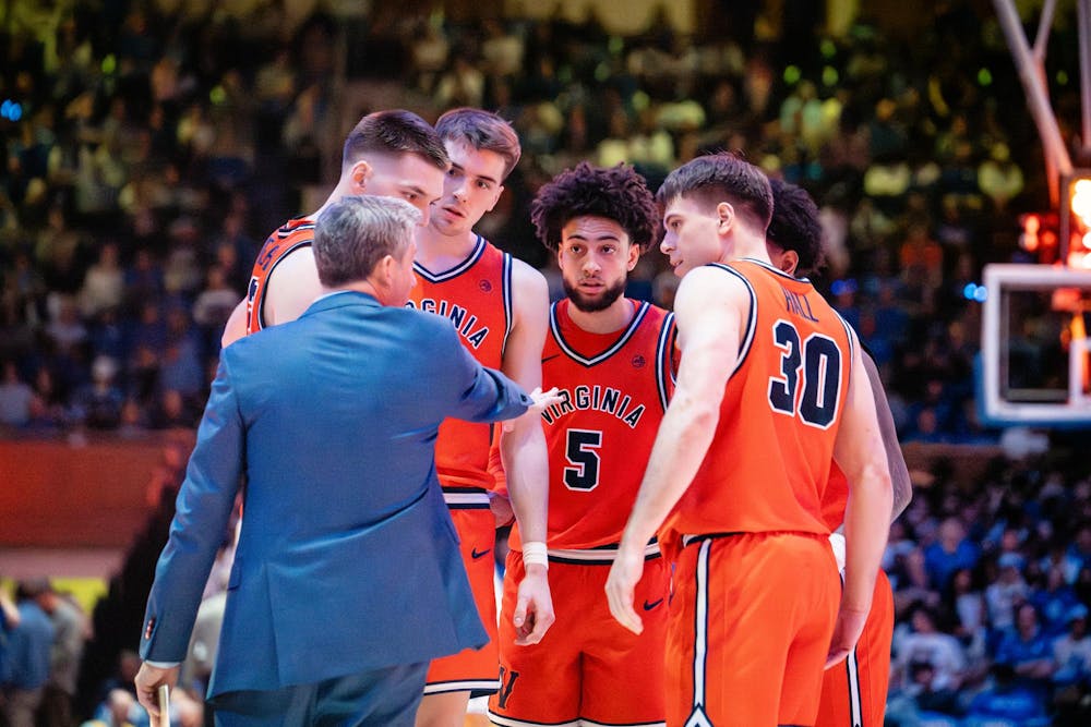 Coach Ryan Odom talks to his starting lineup.