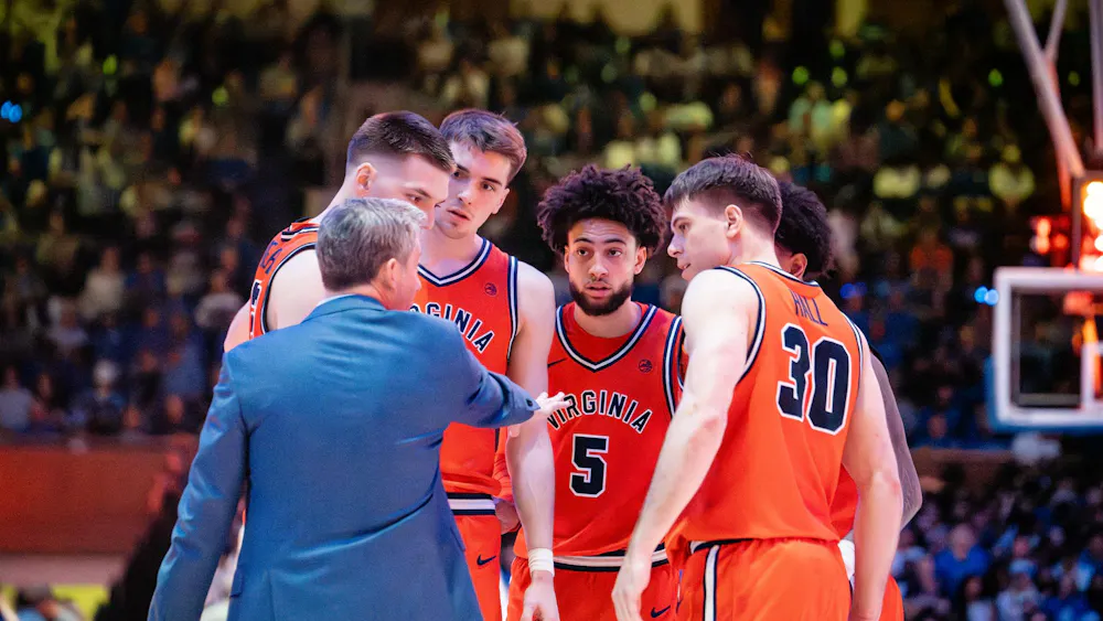 Coach Ryan Odom talks to his starting lineup.