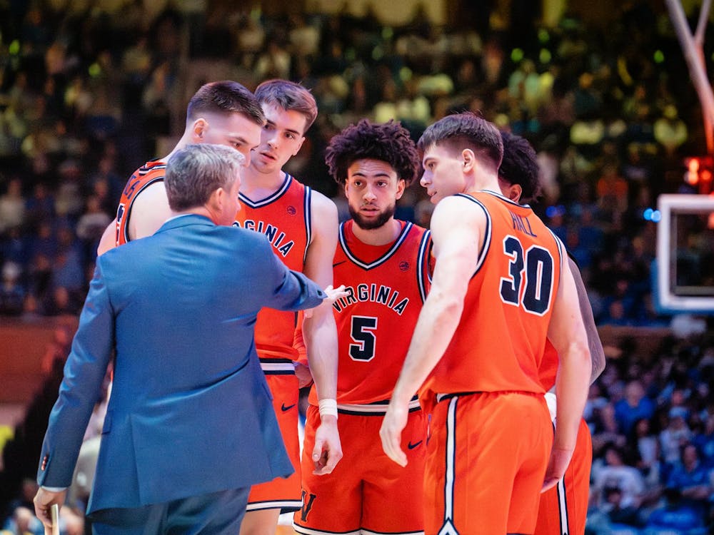 Coach Ryan Odom talks to his starting lineup.