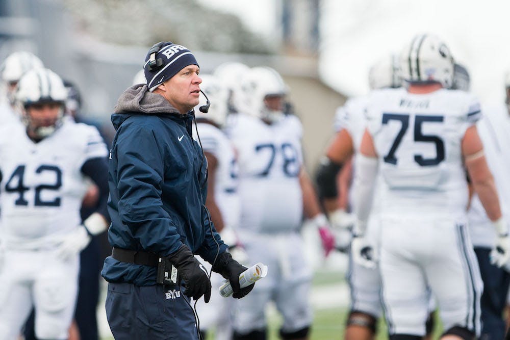 Bronco Mendenhall tries to get the refs attention after they made a call that he didnt agree with during the game against Utah State