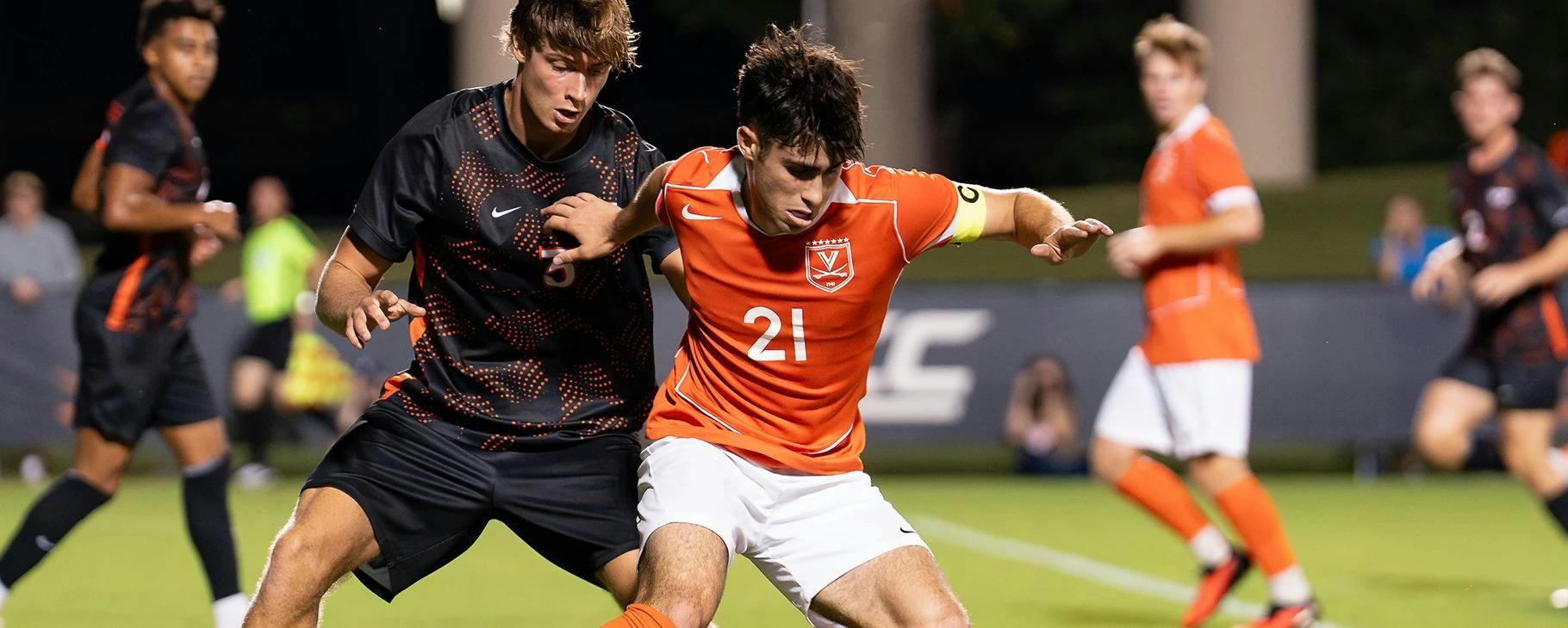 Virginia midfielder Marco Dos Santos, who scored Virginia's lone goal, wrestles with a Virginia Tech player.