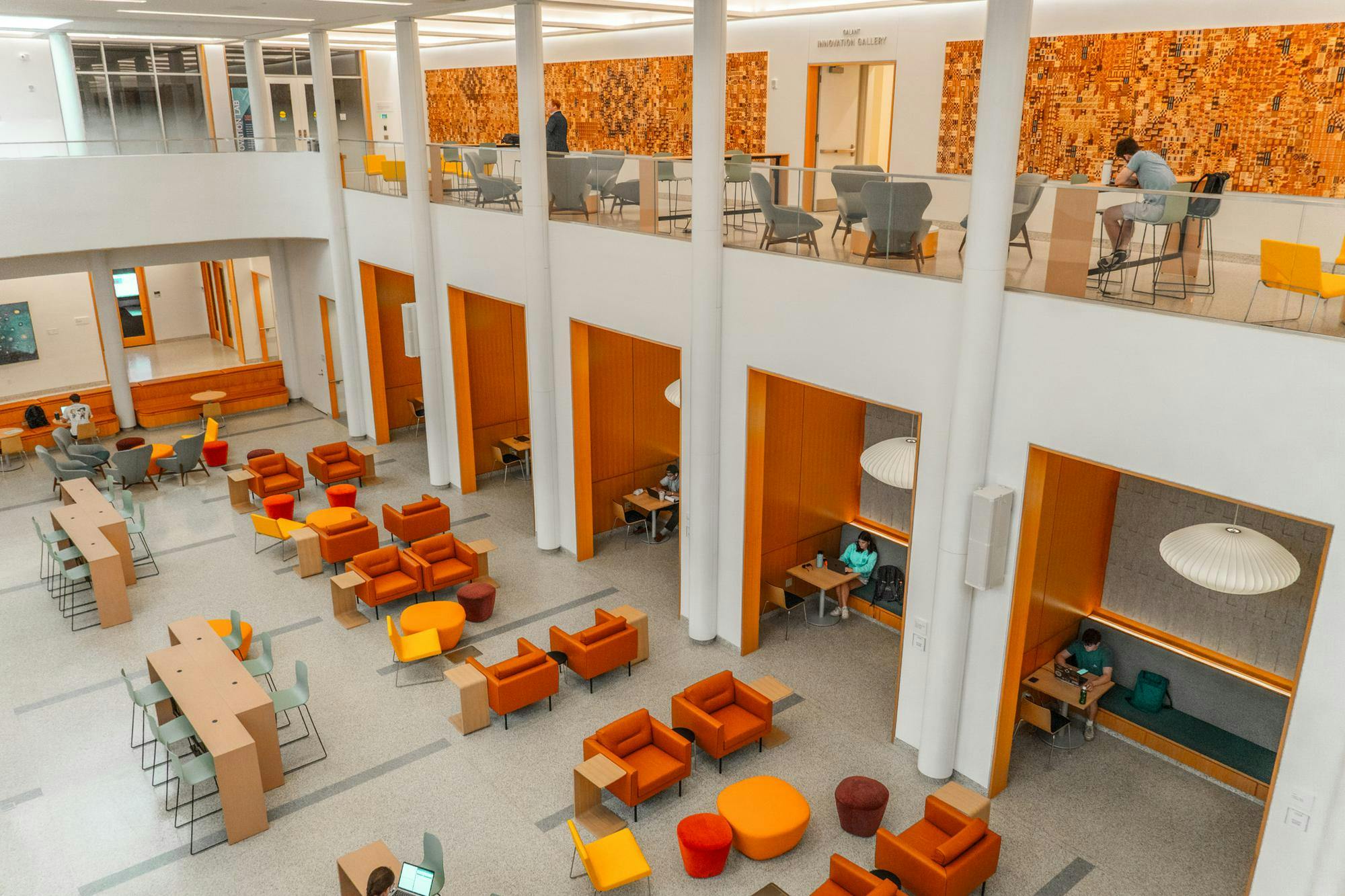 Shumway’s familiar Jeffersonian russet brick exterior holds a much more modern and minimalist interior, characterized by sleek white surfaces and technological integration.