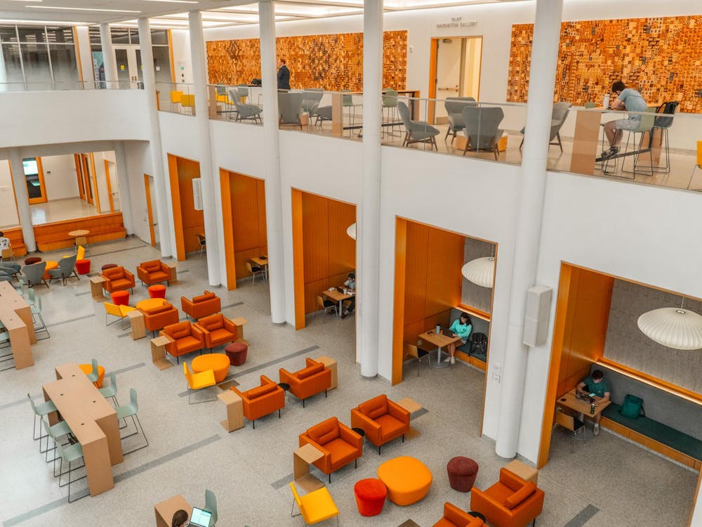 Shumway’s familiar Jeffersonian russet brick exterior holds a much more modern and minimalist interior, characterized by sleek white surfaces and technological integration.