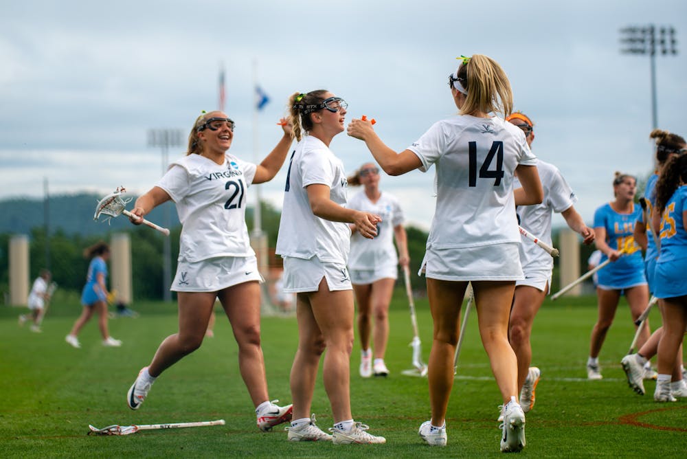 The Cavaliers celebrate one of their 21 goals during the team's resounding victory Friday.