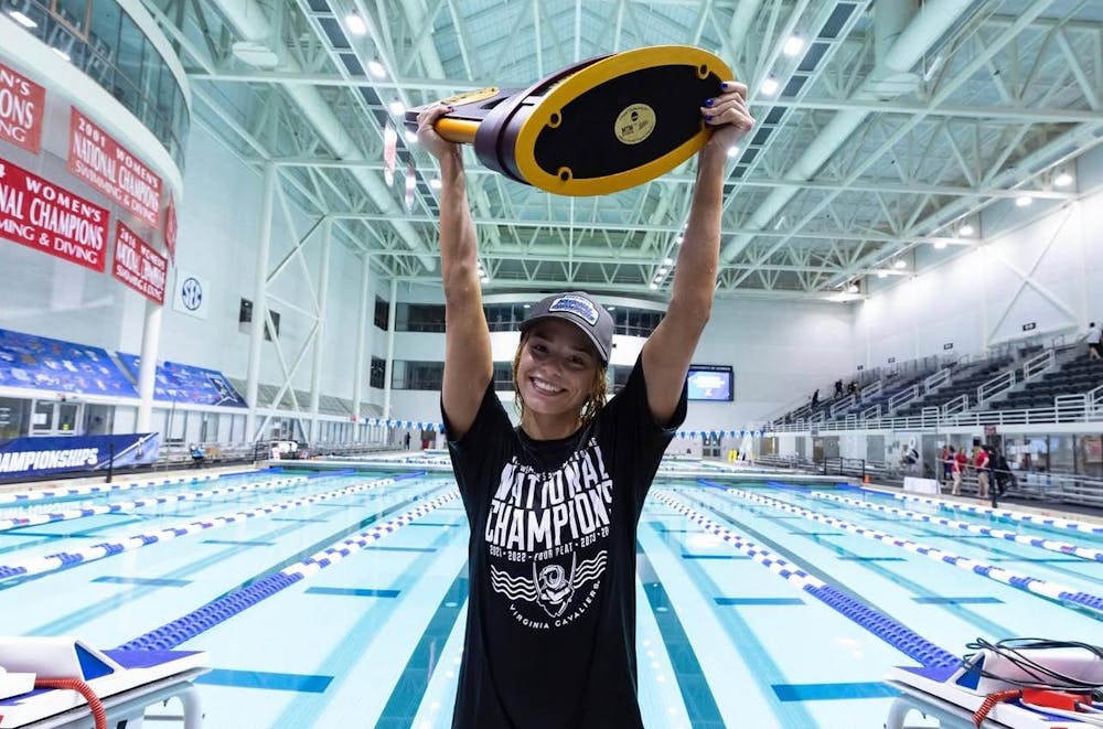 Kaye hoists the 2024 National Championship trophy.