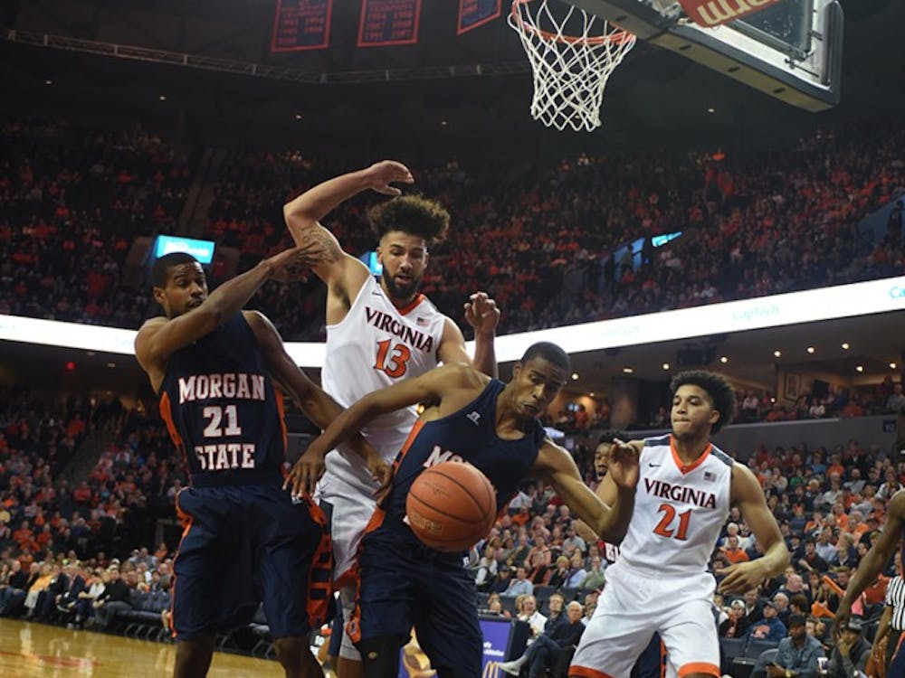 Senior forward Anthony Gill (No. 13) paced Virginia with 16 points on 6-for-8 shooting. He also snagged seven rebounds. 