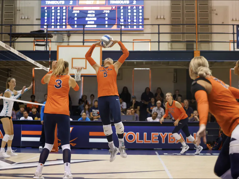 Senior setter Ashley Le leaps to set the ball against Coastal Carolina.