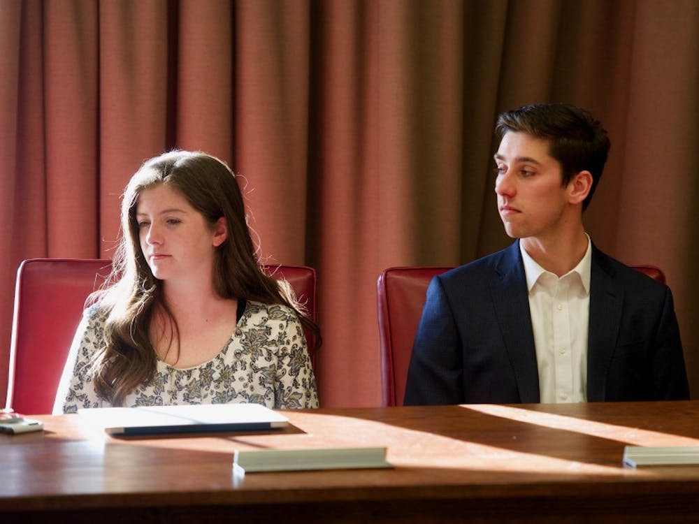 Jordan Arnold (left) and Kevin Warshaw (right) pictured at a University Judiciary Committee meeting in April. Arnold is leading the new committee that will analyze and publish historical UJC documents.