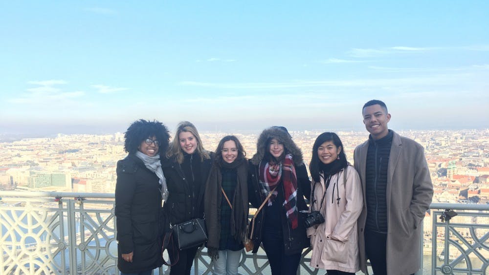 Participants in the London program gather in front of a vista in Naples, Italy.