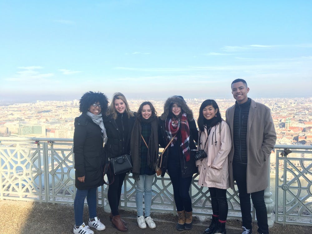 Participants in the London program gather in front of a vista in Naples, Italy.