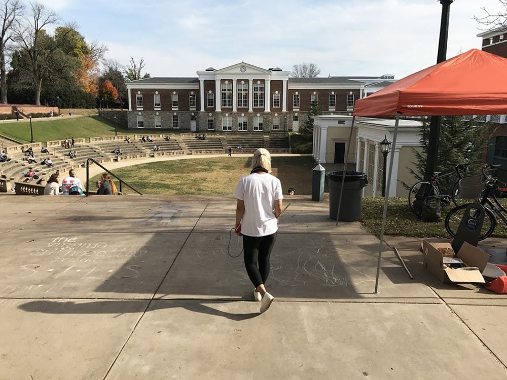 Song begins her&nbsp;final football mural of Cav Man pushing back against Miami’s Ibis.