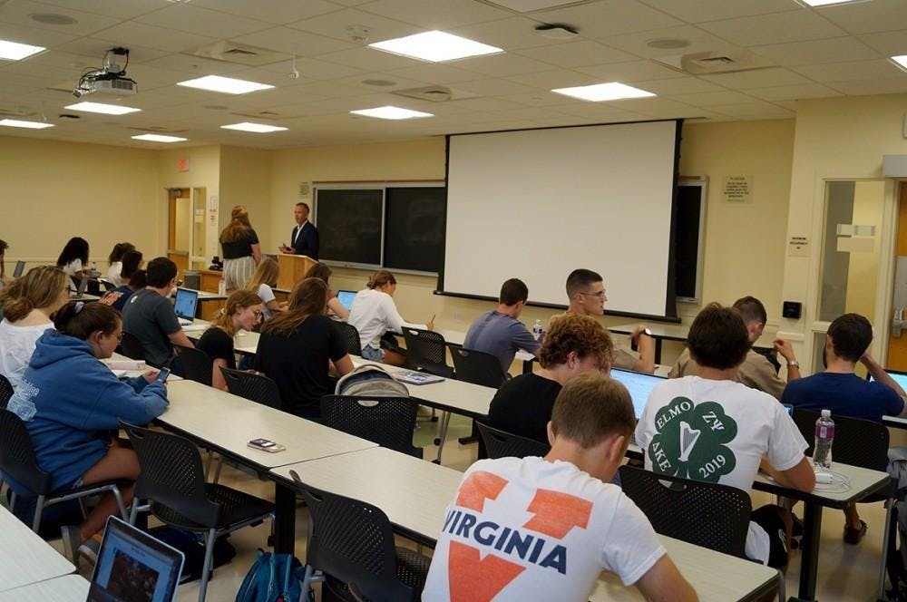  If you walked into the Chemistry Building 402 lecture hall 50 years ago, you would see rows of students handwriting notes — now, you will most likely be met with a wall of screens.